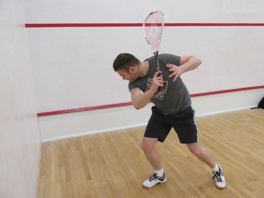 Playing squash on a cold court