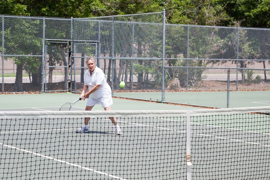 Senior lady playing tennis