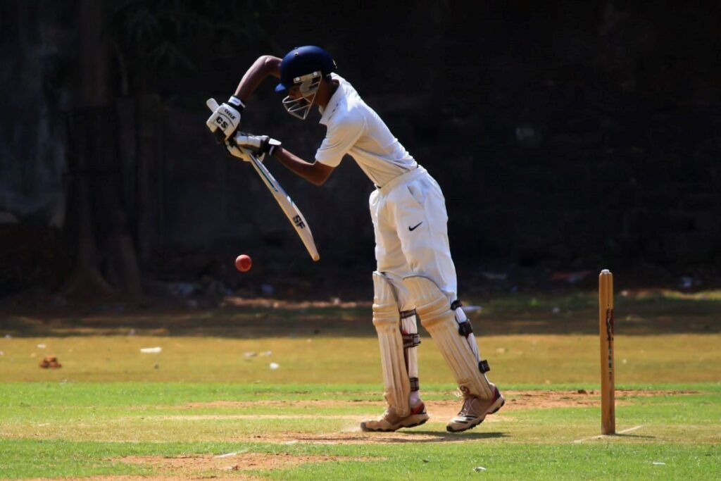 Batsman backfoot defensive shot to a cricket ball